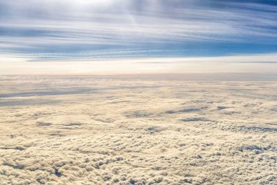 Scenic view of landscape against sky during winter