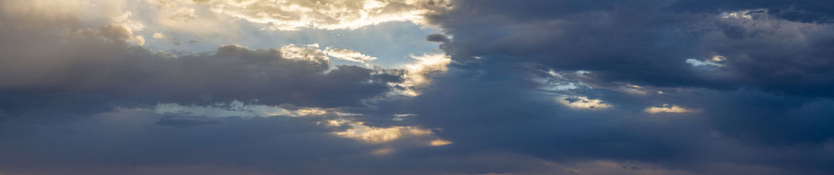 Low angle view of clouds in sky during sunset
