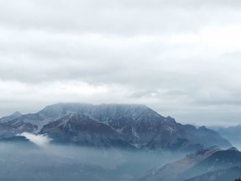 Scenic view of mountains against sky during winter