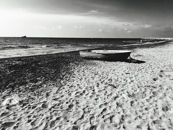 View of calm beach against the sky