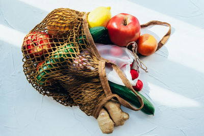 High angle view of fruits in basket on table