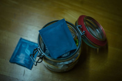 High angle view of packet in jar on table