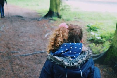 Rear view of girl at park