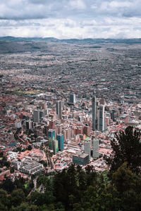 High angle view of trees and buildings against sky