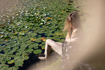 Woman sitting in water