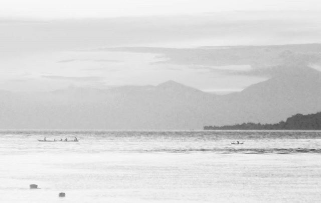 sea, water, horizon over water, beach, scenics, tranquil scene, tranquility, beauty in nature, sky, nature, shore, mountain, nautical vessel, idyllic, sand, wave, boat, waterfront, day, remote