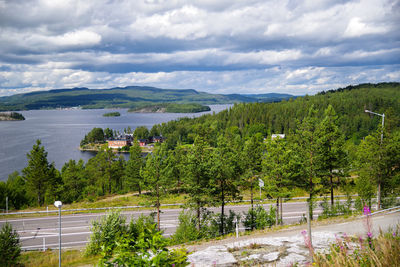 Scenic view of trees and mountains against sky