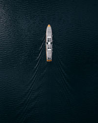 High angle view of ship sailing on sea. aerial boat perspective.