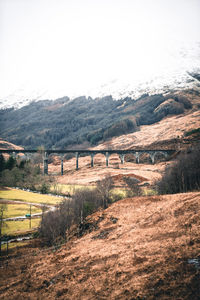 Bridge over land against sky