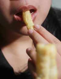 Close-up of woman eating food