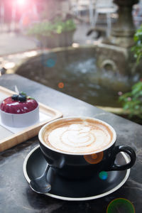 Close-up of cappuccino on table