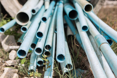 Close-up of pipes on field