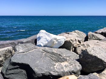 Scenic view of sea against blue sky