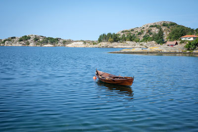 Boat on sea against clear sky