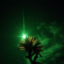 Low angle view of illuminated sky at night