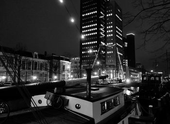 Illuminated buildings in city at night