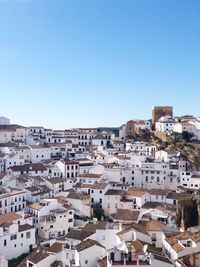 High angle view of townscape against blue sky