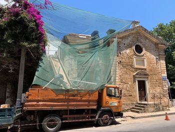 Cars on road against buildings in city