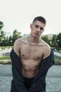 Portrait of young man standing outdoors