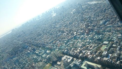 Aerial view of cityscape against sky