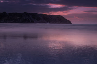 Scenic view of sea against sky at sunset