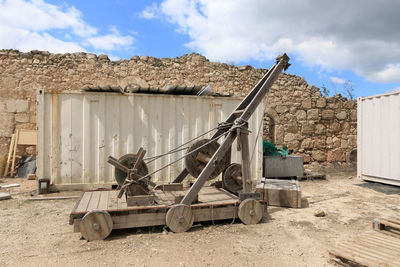 Abandoned truck on field against sky