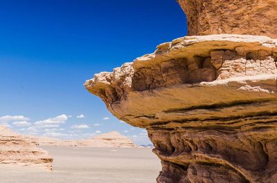 Rock formations against blue sky