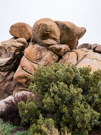 Low angle view of rock formation against sky