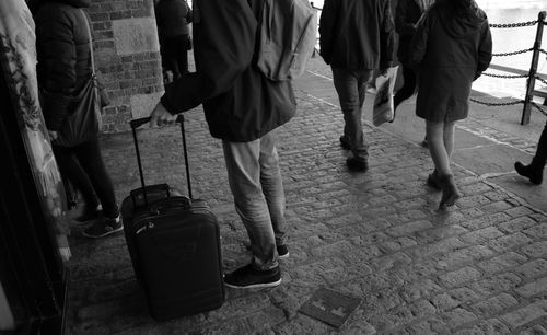 Low section of people standing on floor