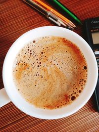 Close-up of cappuccino on table