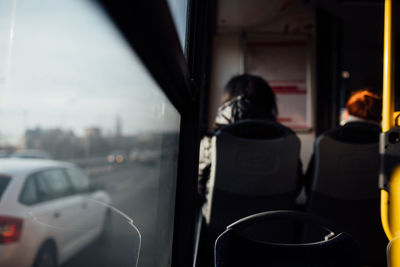 Rear view of people in bus