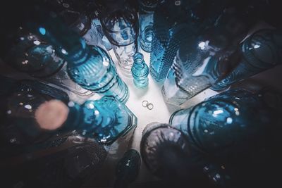 Wedding rings among empty bottles