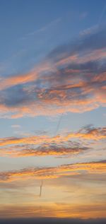 Low angle view of cloudy sky at sunset