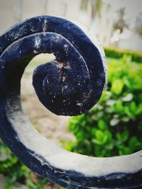 High angle view of water drops on spiral metal