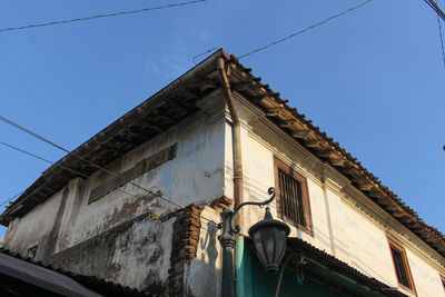 Low angle view of building against clear blue sky