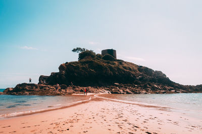Scenic view of beach against clear sky