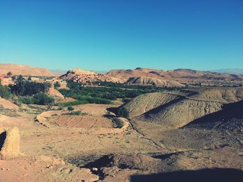 Scenic view of landscape against clear blue sky