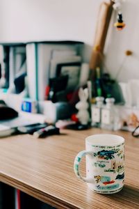 Close-up of mug on table at home