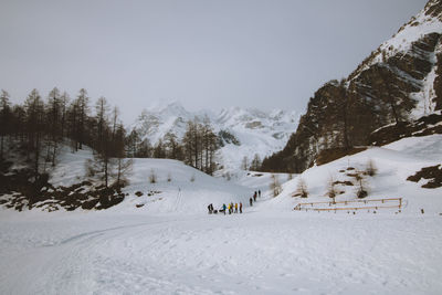 Scenic view of snow covered mountains against sky