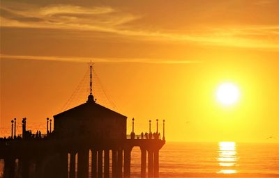 Roundhouse silhouette at manhattan beach pier during beautiful sunset
