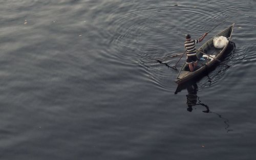 High angle view of swan swimming on lake