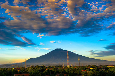 View of volcanic landscape against cloudy sky