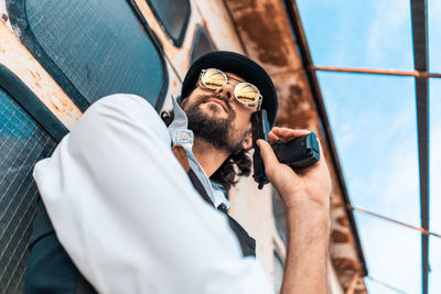 Man photographing with mobile phone