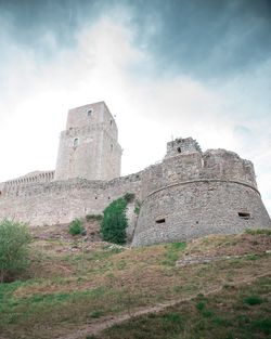 Low angle view of old ruin building against sky