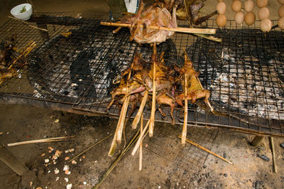 High angle view of meat on barbecue grill