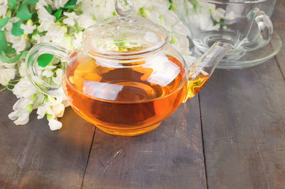 High angle view of herbal tea in kettle on table