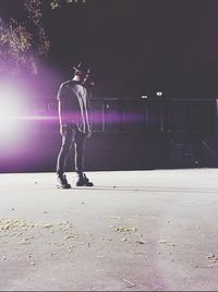 Full length of woman at night