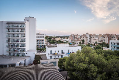 High angle view of buildings in city against sky