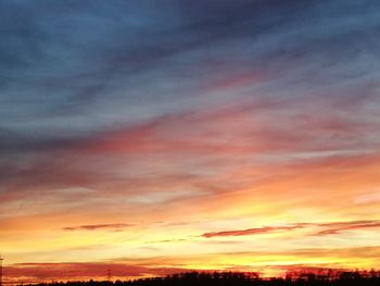 Low angle view of dramatic sky during sunset