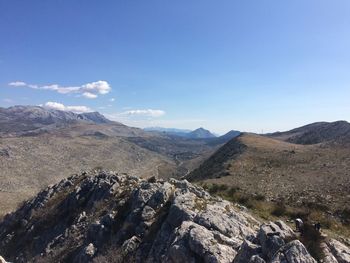 Scenic view of landscape and mountains against sky